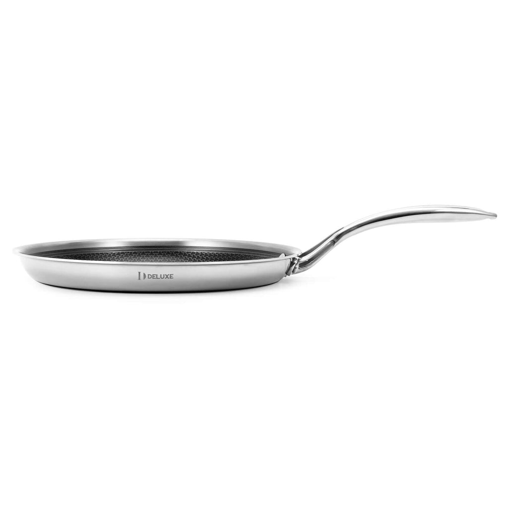 Stainless steel crepe pan with a handle on a white background